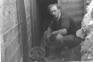 Fighting for his home. A member of Kibbutz Ramat Rahel at the entrance to the kibbutz bunker, and the kibbutz dining hall after shelling I Photo: Israel National Photo Collection
